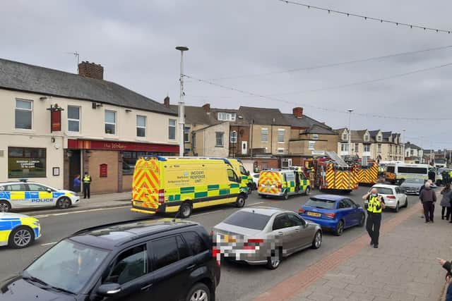 Emergency services have been called to Harbour View Road in Sunderland after a car overturned.
