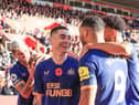 Miguel Almiron of Newcastle United celebrates his goal with fellow Newcastle United players during the Premier League match between Southampton FC and Newcastle United at Friends Provident St. Mary's Stadium on November 06, 2022 in Southampton, England. (Photo by David Cannon/Getty Images)