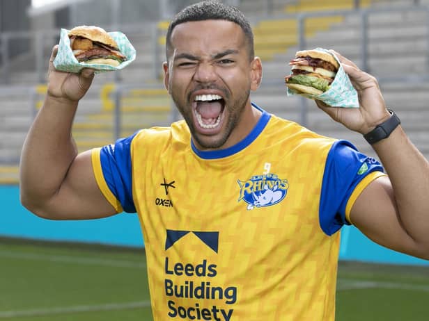 First men’s team captain of the Leeds Rhinos, Kruise Leeming, ‘try-s and tastes’ new Deliveroo x Hooyah Burgers exclusive Leeds Rhinos burger ahead of its launch on National Burger Day, August. 25 (photo: Doug Jackson/PinPep)