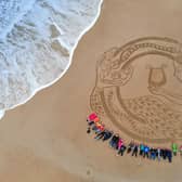 A giant sand art design will be created on Bamburgh Beach to mark the Coronation. Volunteers are welcome to help create the design.