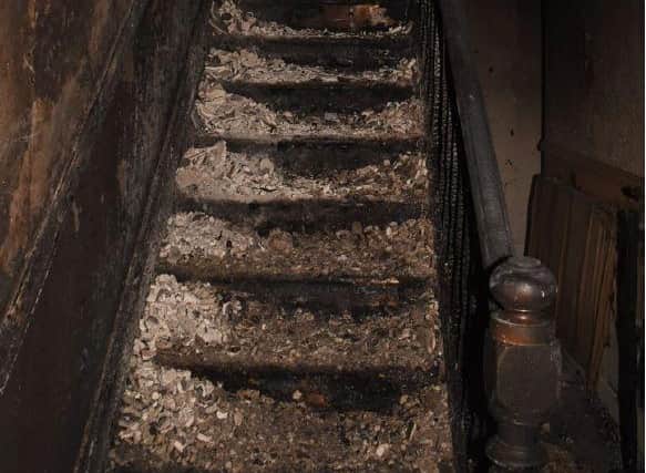 The fire caused extensive damage to the stairway.