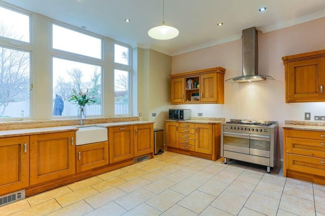 The breakfast kitchen is opposite the lounge and has ample wall and base units, contrasting granite work surfaces, pantry, utility cupboard and access to the rear hallway with storage and equally impressive sunroom.