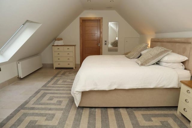 One of five double bedrooms, this pretty room is in the eaves but is certainly not short of space.