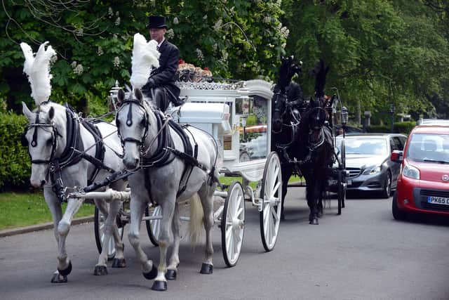 The funeral procession of Alastair and son Mark Rennie arrives at Tynemouth Crematorium.