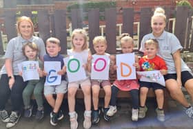 Shauna McKinney (left), Early Years Assistant, and Sophie Watchman, Room Manager, celebrating their good Ofsted judgement with children at the nursery.