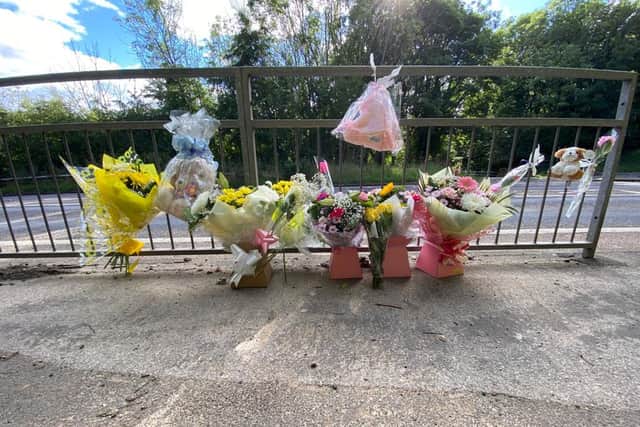 Floral tributes left at the scene of the crash.
