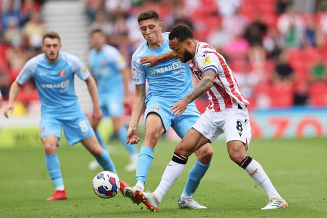 Lewis Baker of Stoke City under pressure from Ross Stewart of Sunderland during the Sky Bet Championship match.