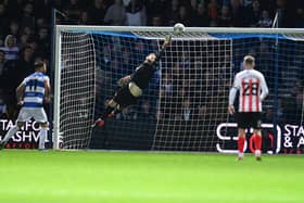 Sunderland goalkeeper Lee Burge makes an excellent save against QPR in the Carabao Cup.