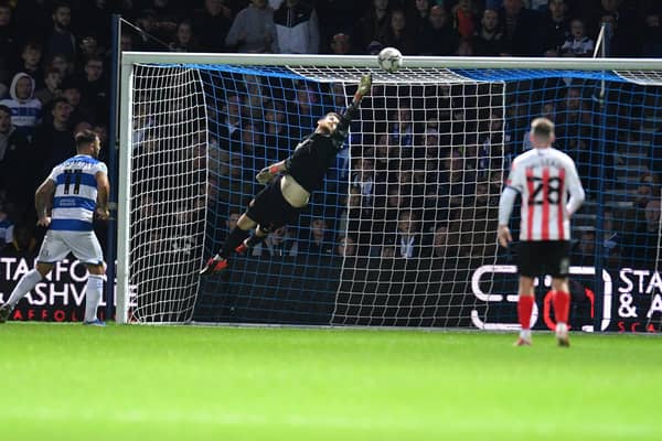 Sunderland goalkeeper Lee Burge makes an excellent save against QPR in the Carabao Cup.
