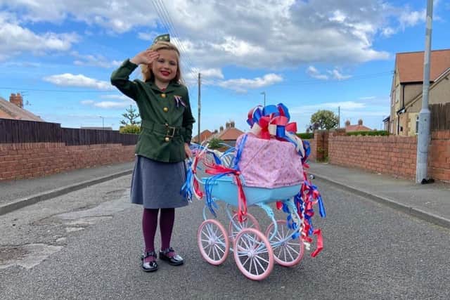 Blossom Todd, 7, dressed up and delivered afternoon tea to her neighbours on VE Day.