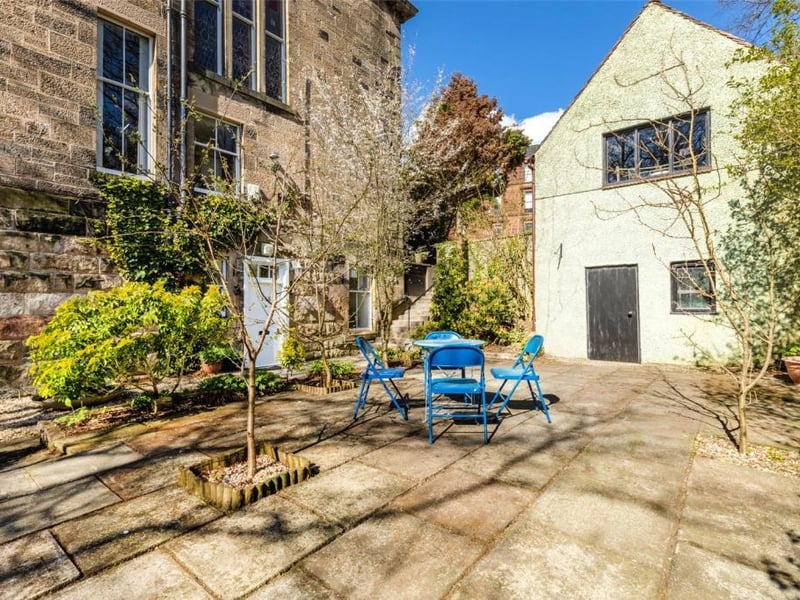 Patio area and private entrance to garden level apartment.