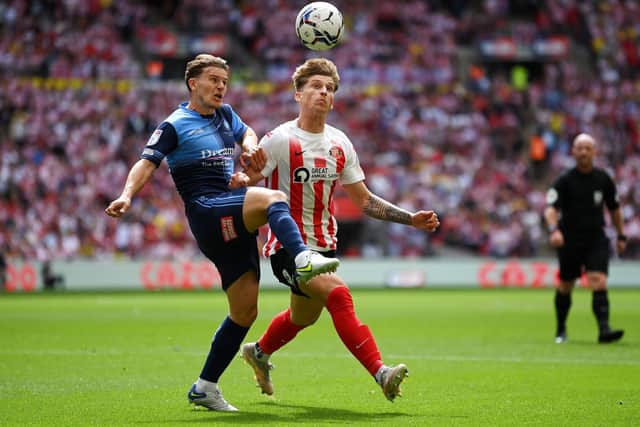 LONDON, ENGLAND - MAY 21: Dominic Gape of Wycombe Wanderers battles for possession with Dennis Cirkin of Sunderland during the Sky Bet League One Play-Off Final match between Sunderland and Wycombe Wanderers at Wembley Stadium on May 21, 2022 in London, England. (Photo by Justin Setterfield/Getty Images)