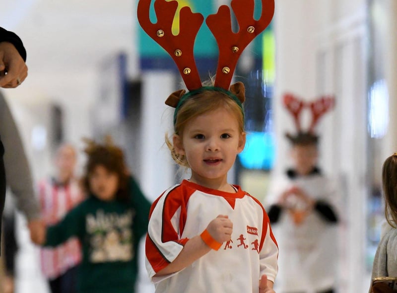 A young runner enjoying the fourth annual Reindeer Dash.