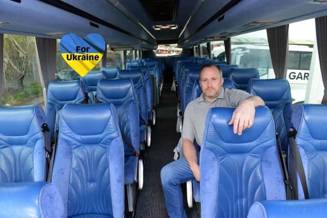 Gardiners Holidays Managing Director Adrian Smith onboard one of the coaches which will be used to relocate fleeing refugee families from Ukraine.