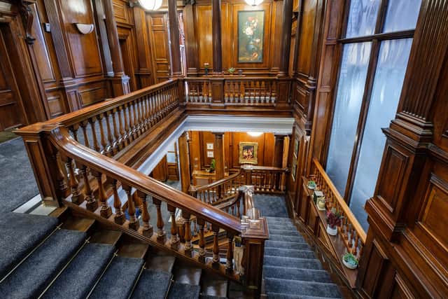 The staircase is one of the striking original features. Photo by Robin Hunter.