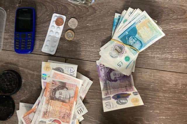 Around £10,000 in cash was seized by officers in the raid.
