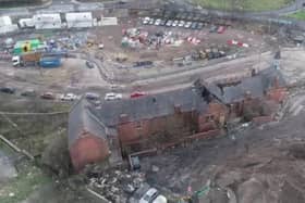 Aerial footage shows the scale of damage following the fire.