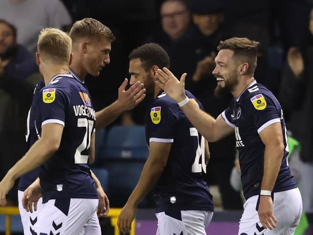 Tom Bradshaw of Millwall is congratulated after scoring against Watford at The Den. (Photo by Warren Little/Getty Images)