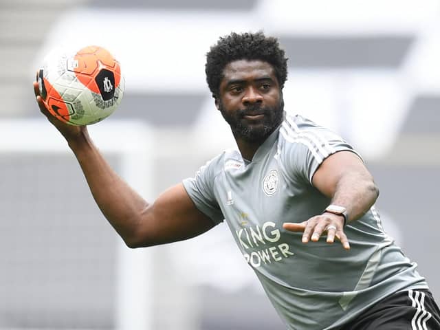 Leicester City's first team coach Kolo Toure warms up the players ahead of the Premier League game against Tottenham Hotspur.