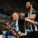 Matty Longstaff of Newcastle United celebrates with team mate Andy Carroll after he scores the only goal of the game during the Premier League match between Newcastle United and Manchester United at St. James Park on October 06, 2019 in Newcastle upon Tyne, United Kingdom.