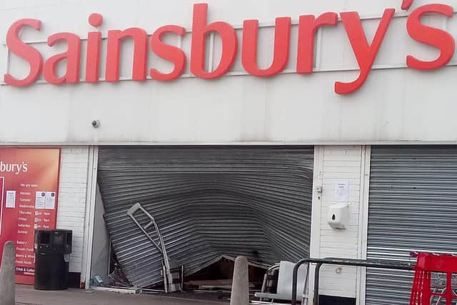 The crushed barrier at the front of the Sainsbury's store.