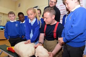 Firefighter Chris Smith and Red Sky Foundation founder Sergio Petrucci visited St Mary's RC Primary School to show pupils how to do CPR and how a defibrillator works.