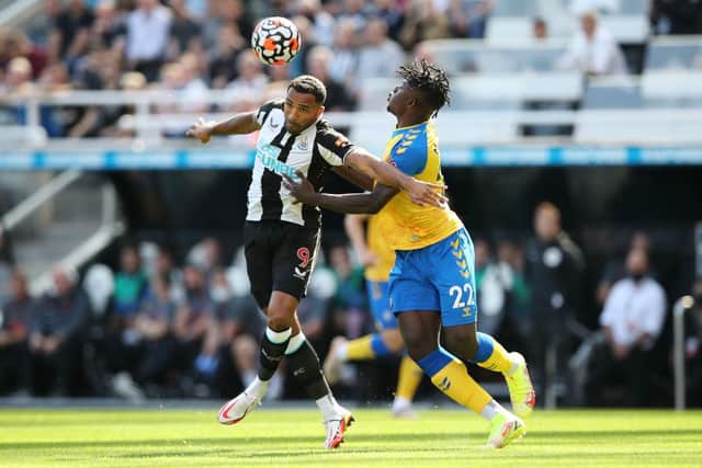 Southampton's Mohammed Salisu challenging with Newcastle United's Callum Wilson (Photo by Ian MacNicol/Getty Images)