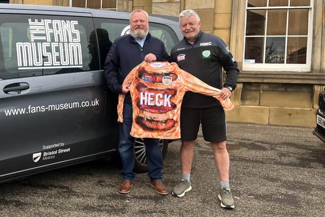 Fans Museum founder Michael Ganley, left, receives the "Toad in the Goal" kit from Bedale AFC chairman and Sunderland fanatic Martyn Coombs.
