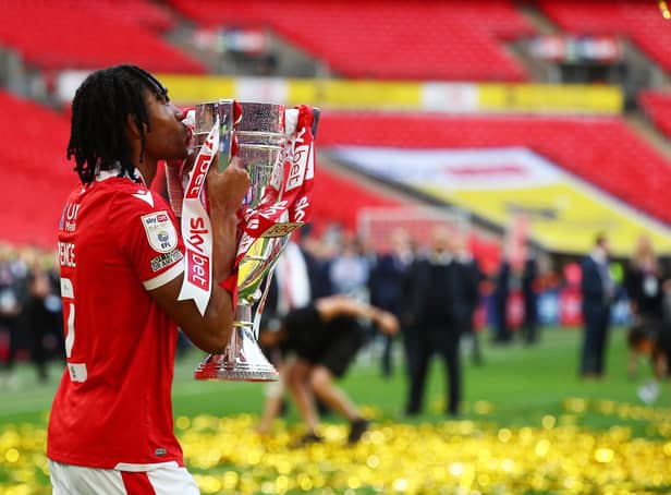 LONDON, ENGLAND - MAY 29: Djed Spence of Nottingham Forest kisses the trophy following their sides victory in the Sky Bet Championship Play-Off Final match between Huddersfield Town and Nottingham Forest at Wembley Stadium on May 29, 2022 in London, England. (Photo by Christopher Lee/Getty Images)