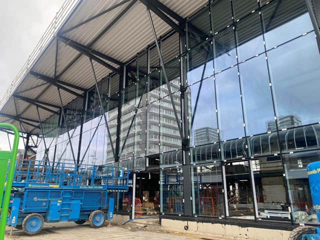 The glass frontage is being put in place at the new entrance overlooking Market Square
