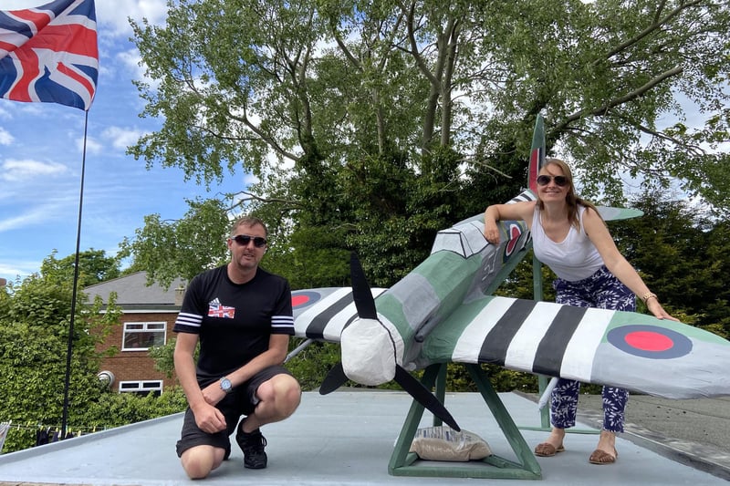 Fenwick Avenue residents Darren and Victoria Hanson with a Spitfire plane they created to commemorate the anniversary of VE Day during their street party last year.