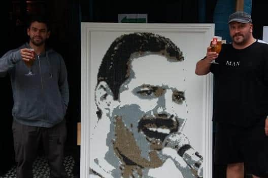 Darren Timby, right, and Malcolm Hassan with the Freddie Mercury artwork. Picture: Darren Timby.
