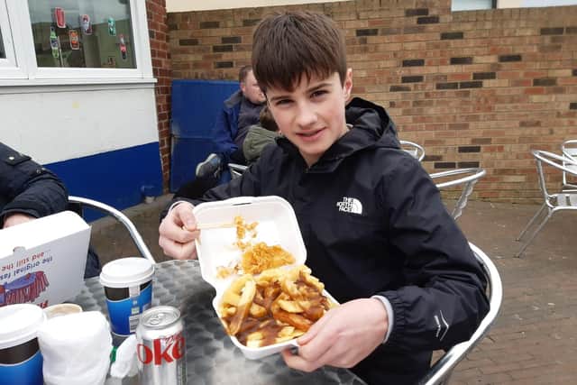Fenton Frank, 13, with his fish, chips and gravy.