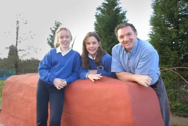 Australian teacher Jim Hill was pictured with Year 6 pupils Georgina Gill and Harriet Johnson with their model of a famous landmark in 205.