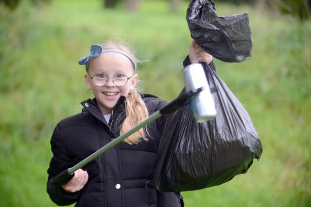 Lucy McCormick, nine, is so annoyed by litter droppers in King George Park that she is tackling the problem herself. Sunderland Echo image.