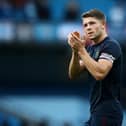 James Tarkowski of Burnley acknowledges the fans after his sides defeat in the Premier League match between Manchester City and Burnley at Etihad Stadium on October 16, 2021 in Manchester, England. (Photo by Jan Kruger/Getty Images)
