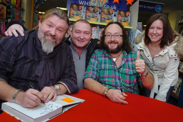 The Hairy Bikers, Si King and Dave Myers signed copies of their new book in WH Smiths for fans Anthony Cook and Claire Shipley in 2011.