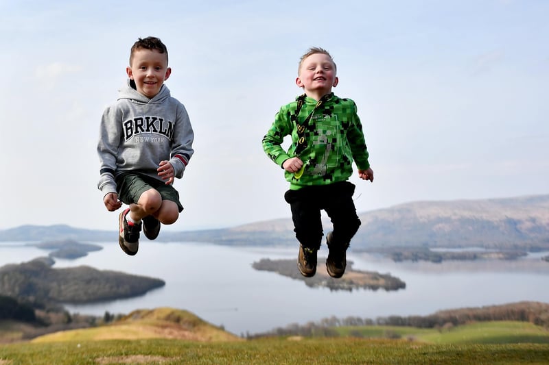 Two young boys enjoying their walk at Loch Lomond. Families can meet for the first time in months after restrictions on travel and outdoor meetups lifted on Friday.