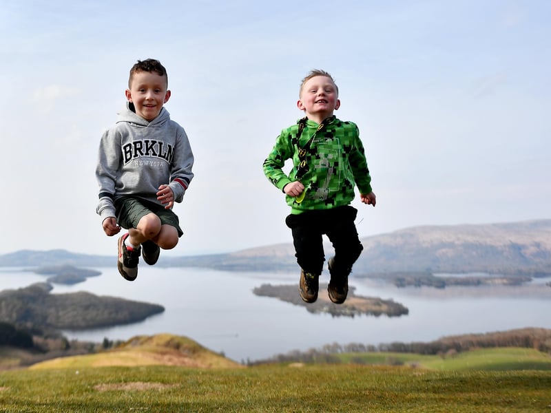 Two young boys enjoying their walk at Loch Lomond. Families can meet for the first time in months after restrictions on travel and outdoor meetups lifted on Friday.