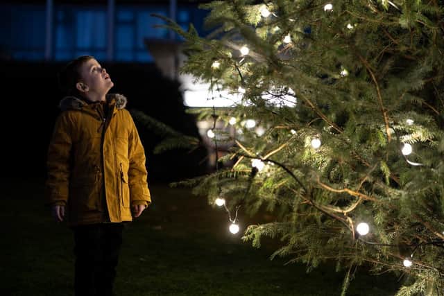 Brave Harry Coulson, 6, marked the end of his cancer treatment by lighting up Durham city's Christmas tree lights.