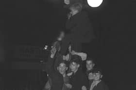 These youngsters climbed a lamppost just to get a better view of the packed proceedings.