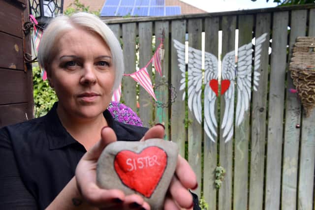 Karen Hughes created heart-inspired artwork to help people cope after losing loved ones.
