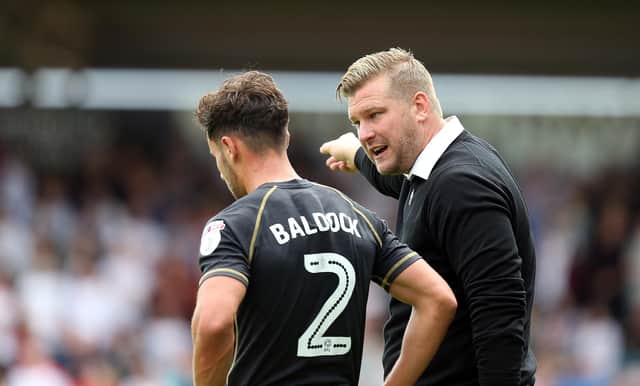 NORTHAMPTON, ENGLAND - SEPTEMBER 04: Milton Keynes Dons manager Karl Robinson make a point to George Baldock during the Sky Bet League One match between Northampton Town and Milton Keynes Dons at Sixfields Stadium on September 4, 2016 in Northampton, England.  (Photo by Pete Norton/Getty Images)