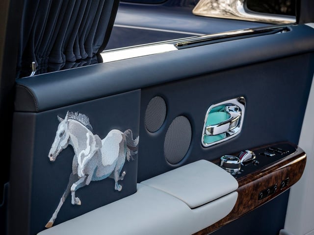 CANVAS: PHANTOM EXTENDED │MEDIUM: EMBROIDERY
Complex Bespoke embroideries of a stallion embellish the interior rear doors of this elegant Phantom Extended. Signifying strength and an unremitting enthusiasm to progress, the embroidery of the steed was developed from a sketch, presented to the Rolls-Royce Bespoke Design Collective, by a Chinese client with a very clear vision.