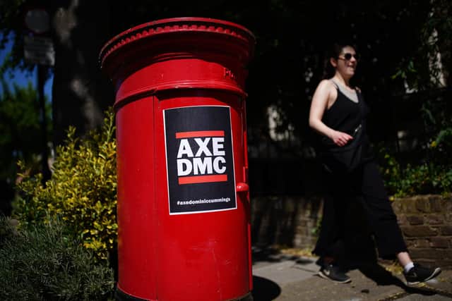 A post box with an AXE DMC poster, with the hashtag axedominiccummings, near the north London home of Dominic Cummings. Picture: PA.