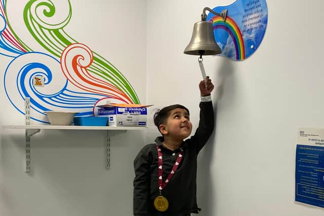 Saahib Randhawa rings the bell to mark the end of his cancer treatment.