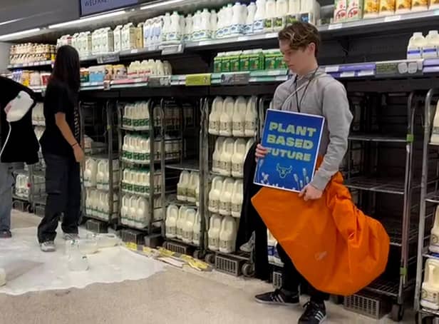 <p>Handout photo issued by Animal Rebellion of supporters of Animal Rebellion pouring out milk in a Waitrose in Edinburgh. Issue date: Saturday October 15, 2022.</p>