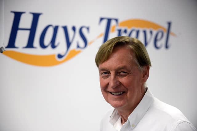 Hays Travel owner John Hays died aged 71 after collapsing while 'doing the job he loved'.