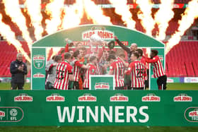 Sunderland lift the Papa John's trophy at Wembley Stadium.