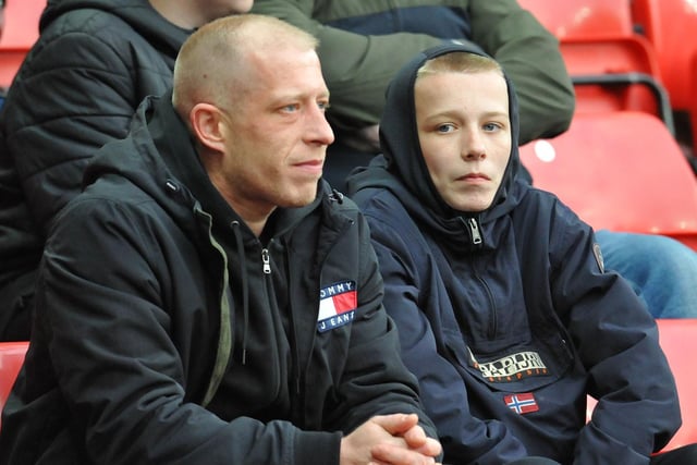 A pair of Sunderland fans watch the game against Rotherham United.